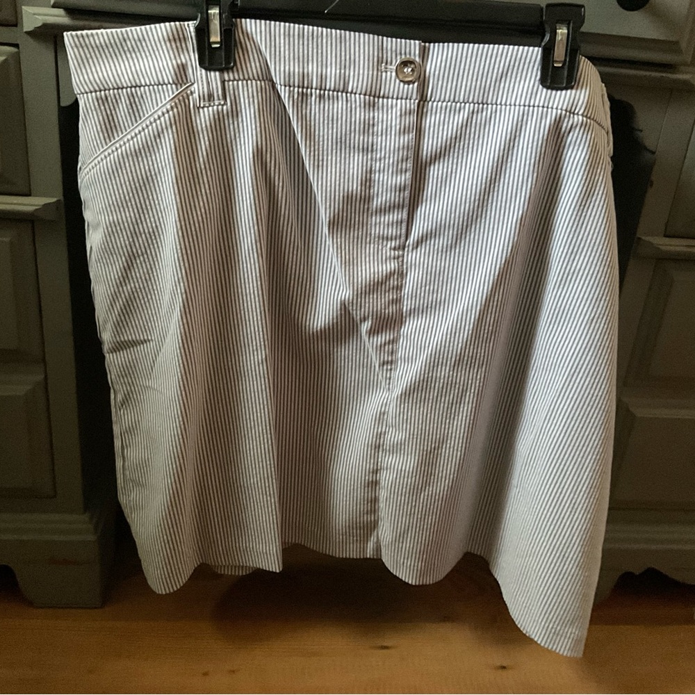 These shorts are black and white with a button